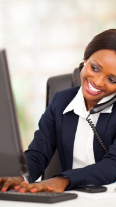 Coordinator on the phone at a computer